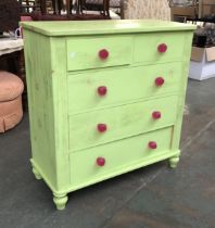 A bright green painted chest of drawers with pink acrylic handles, 101x45x104cmH
