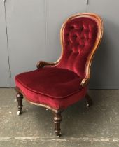 A Victorian walnut framed button back slipper chair, with serpentine seat, 61cmW
