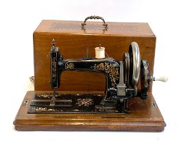 A Frister & Rossmann sewing machine in marquetry case, serial no. 361908