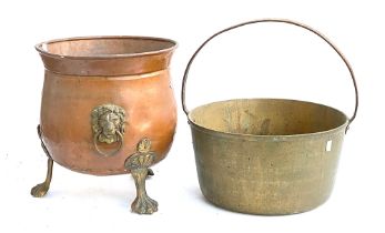 A copper coal bucket with lion mask loop handles, 35cmH; together with a large brass saucepan