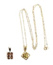 A 9ct gold star shaped pendant set with a peridot, on a 9ct gold chain, gross weight 1.5g;