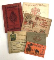 Four books of postcards from Ypres, Waterloo and Tangers, together with two programmes of the