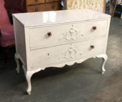 A 20th century two drawer white painted commode chest, the drawers with applied urn mouldings,