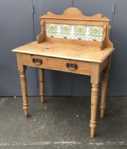 A late 19th/early 20th century pine washstand, with tiled upstand and single drawer, 84x45x74cmH