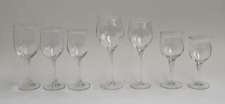 A large quantity of wine glasses comprising three different designs: slightly lobed design, the