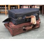 A vintage faux alligator leather suitcase in canvas slip, monogrammed E.W in gilt lettering,