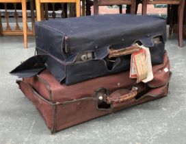 A vintage faux alligator leather suitcase in canvas slip, monogrammed E.W in gilt lettering,