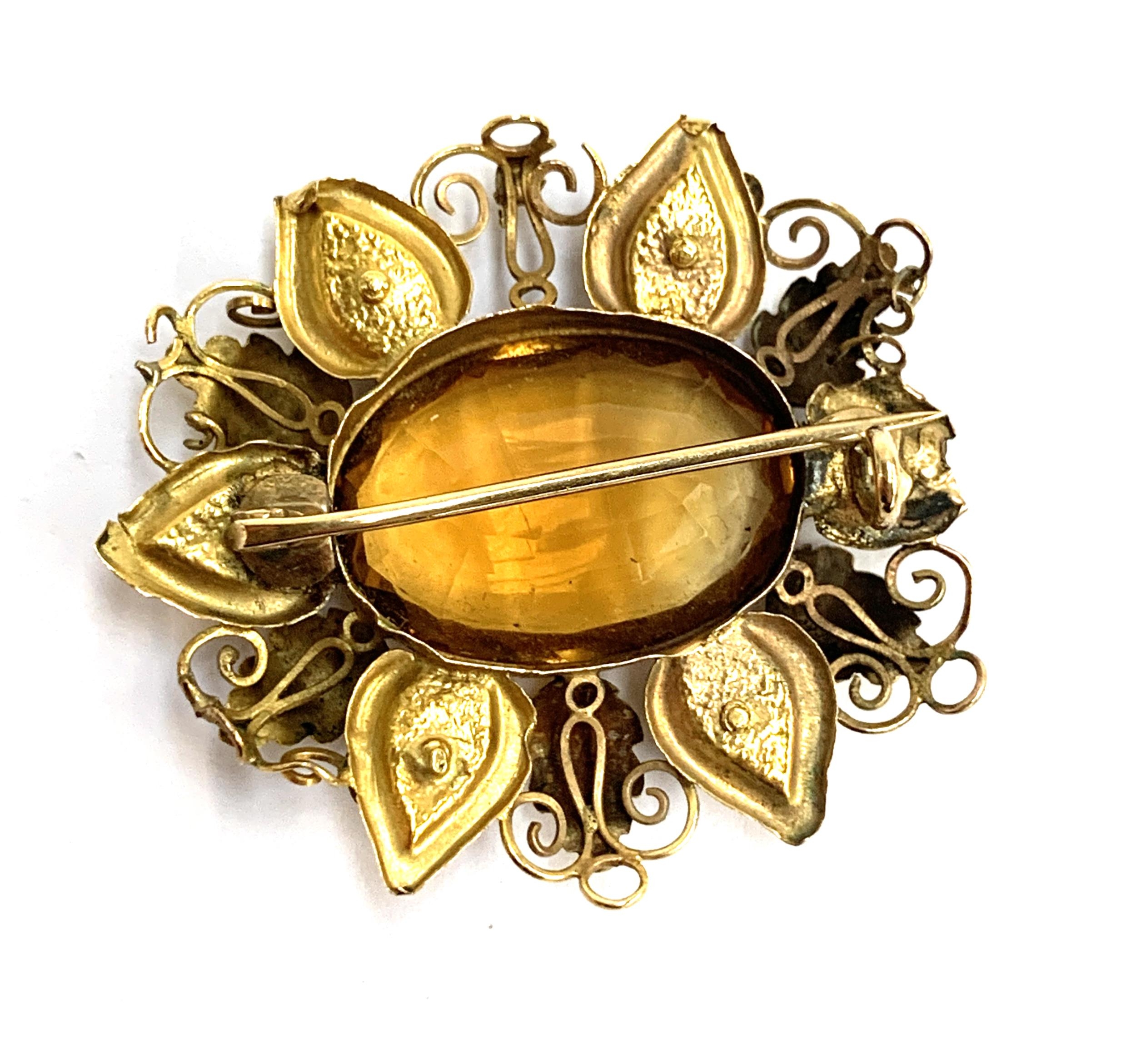 A two coloured gold brooch set with a central citrine surrounded by leaves and flowers (af), 3.7cmL, - Image 2 of 2