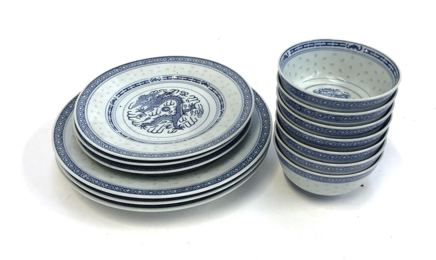 A large quantity of translucent riceware with dragons comprising dinner plates (3), side plates (