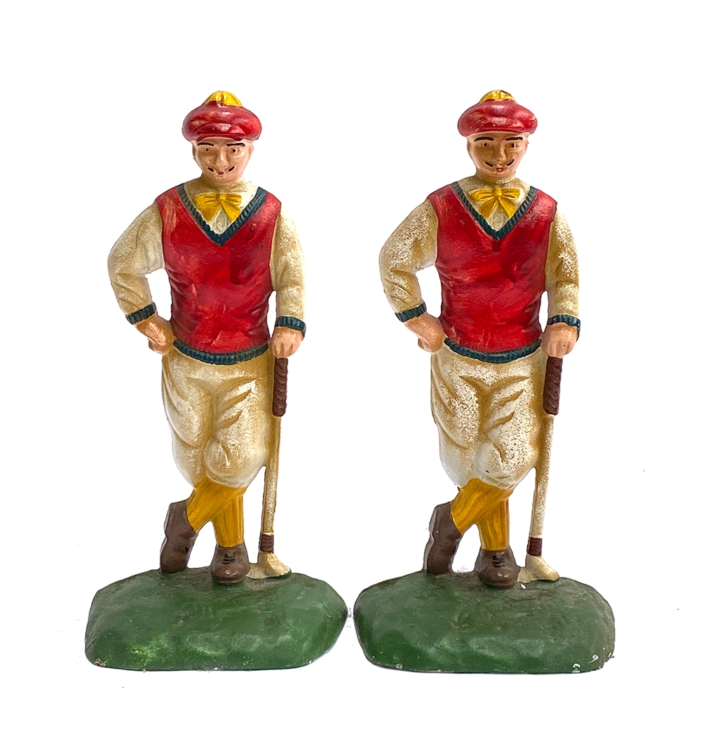 A pair of painted cast iron doorstops in the form of golfers, 26cmH