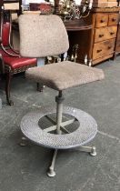 A vintage adjustable industrial chair