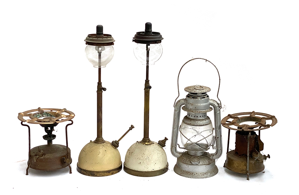 A mixed lot comprising two Tilley 'Table Moden' paraffin lamps, a further paraffin lantern, and