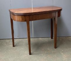 A George III mahogany and line inlaid tea table, on square tapered legs, 91x45x73cmH