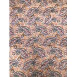 A paisley and floral orange ground bed spread, approx 175x205cm; together with one other, red ground