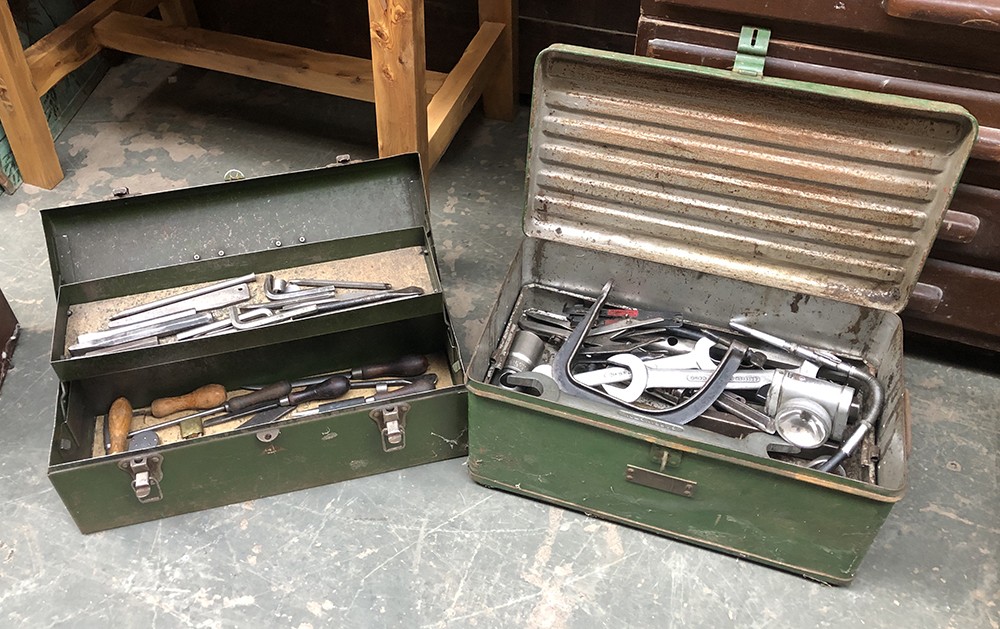 Two vintage green painted tool boxes, containing a quantity of very large spanners, sockets etc