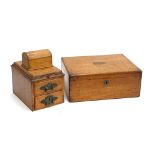 An oak desktop stationery box, associated domed casket, moulded top with stamp drawer, 16cmW;