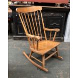 A 20th century beech stick back rocking chair, 60cmW