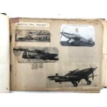 An album relating to WWII aircraft containing a quantity of photos, newspaper clippings, cigarette
