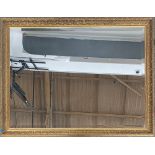 A large gilt framed mirror with bevelled glass, 113x87cm