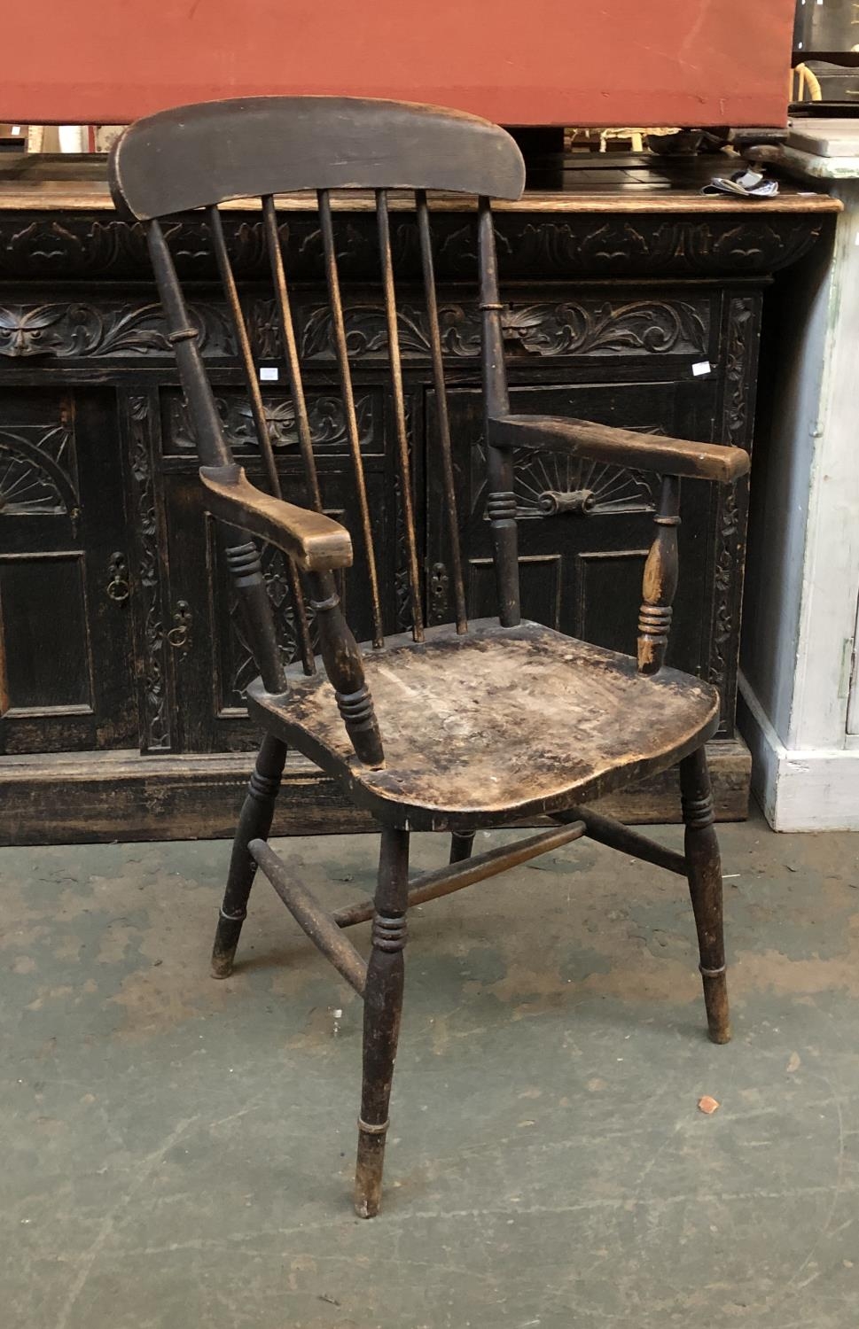 An ash and elm stickback open armchair on ring turned legs and H stretcher