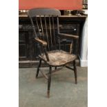 An ash and elm stickback open armchair on ring turned legs and H stretcher