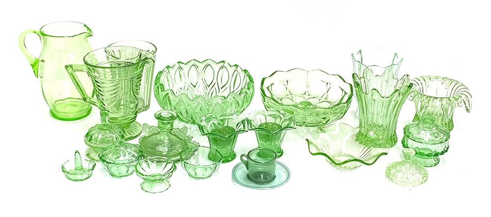 A quantity of green glassware to include a handblown cup and saucer