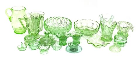 A quantity of green glassware to include a handblown cup and saucer