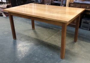 A modern kitchen table with solid Iroko hardwood top, on square section legs, 153x92x77cm