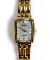 A ladies Accurist wristwatch, gold plated with mother of pearl rectangular dial