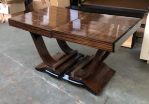 A contemporary macasser ebony centre table, 160x66x74 with additional leaves each 23cmL