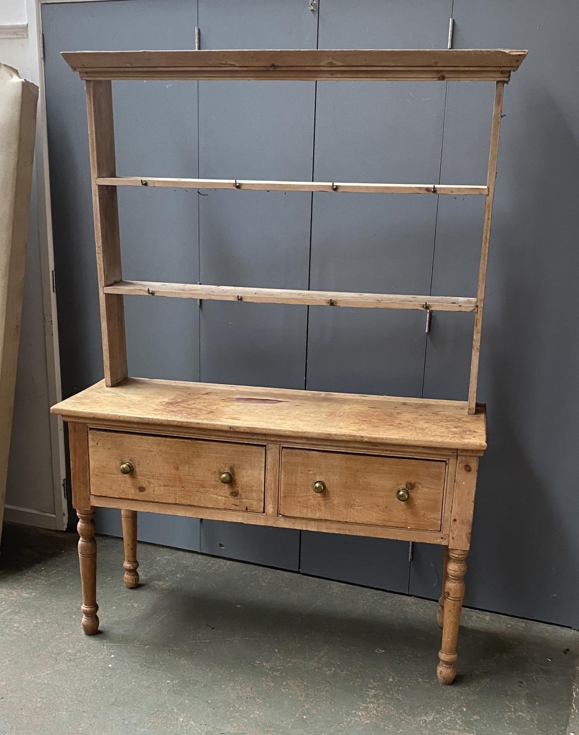 A 19th century pine kitchen dresser, the rack with two shelves, over a base of two drawers, on - Image 2 of 2