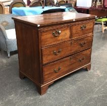 A George III and later chest of drawers, crossbanded walnut top, over two short and two long