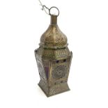 An eastern pierced metal and coloured glass lantern, fitted for electricity, 52cmH