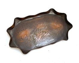 A Newlyn school copper tray with wavy edge, engraved with a fish, 38x23cm