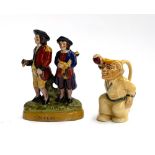 A Staffordshire 'Golfers' figurine, 24cmH; together with a cricketer jug (2)