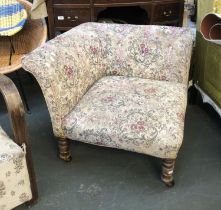 An upholstered corner chair on turned legs