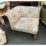 An upholstered corner chair on turned legs