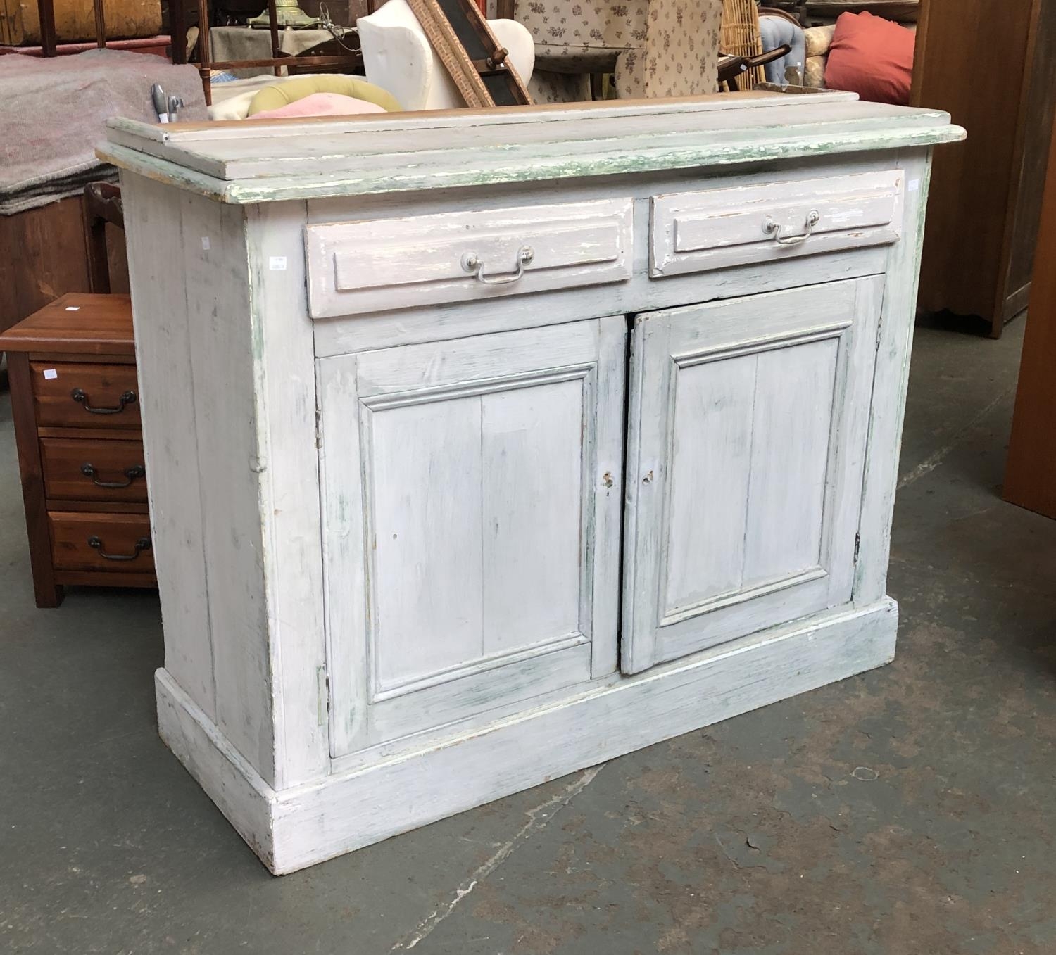 A grey/green painted pine dresser base, two panelled doors on a plinth base, 132x50x103cmH