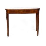 A George III mahogany and line inlaid tea table, foldover top raised on square tapered legs,