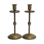 A pair of 19th century brass and copper candlesticks with knopped stems, 20.5cmH