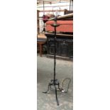 A wrought iron standard lamp, 140cmH