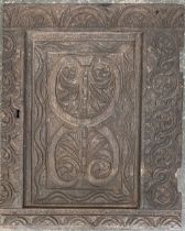 A carved 17th/18th century oak panel, 48x38cm