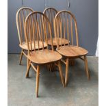 A set of four mid century Ercol style stickback kitchen chairs