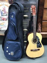 A Kay acoustic guitar, K135, in remix soft carry case