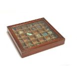 A glazed mahogany specimen cabinet containing a quantity of minerals, 38cm square