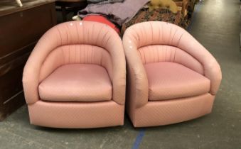 A pair of pink upholstered tub chairs on swivel bases, 75cmW