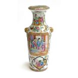 A late 19th century Chinese famille rose vase of baluster form with applied lion mask handles,