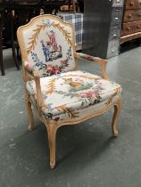 A 20th century beechwood open armchair, in the French taste