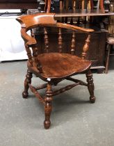 A 19th century ash and elm smokers bow armchair, on heavily turned legs and double H stretcher,