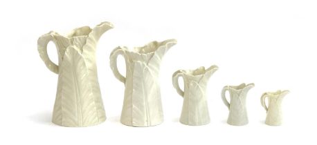 A set of five graduating Royal Worcester banana leaf jugs